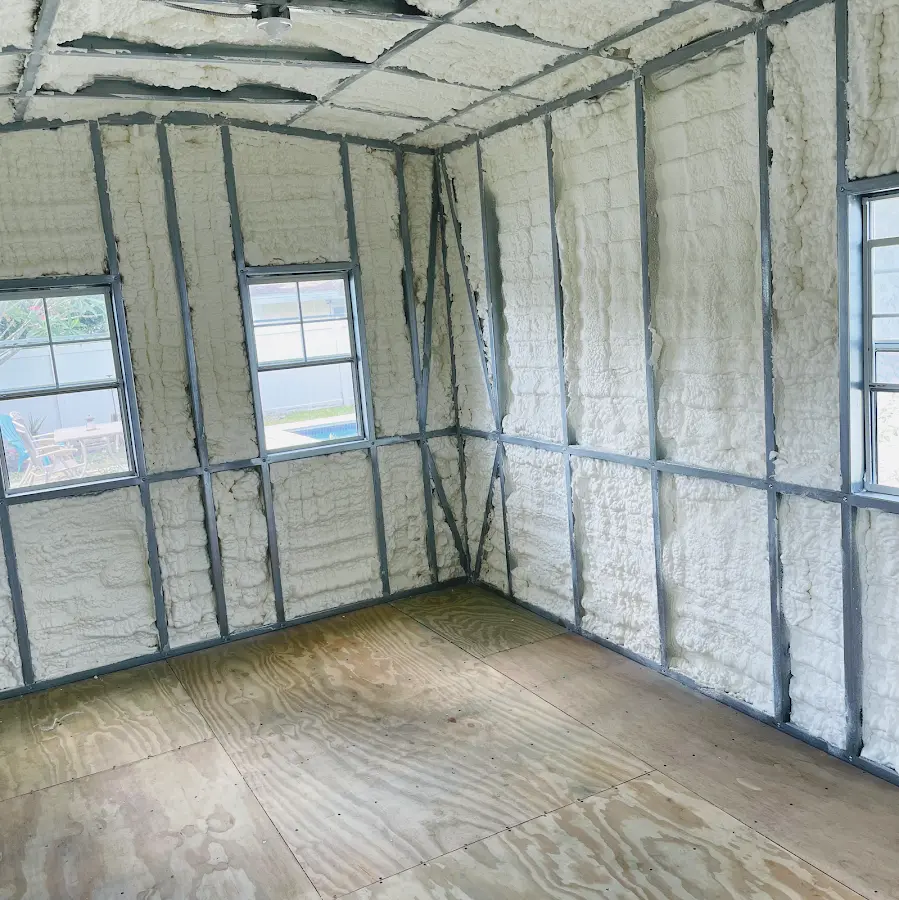 Closed-cell spray foam insulation applied to wall cavities in a residential project in Du Quoin